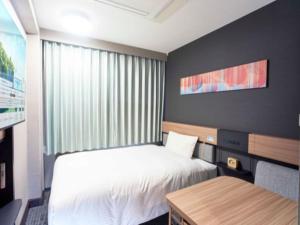 Letto o letti in una camera di Washington R&B Hotel Nagoya Sakae Higashi