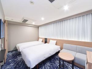 Postel nebo postele na pokoji v ubytování Washington R&B Hotel Nagoya Sakae Higashi + 16 fotografií