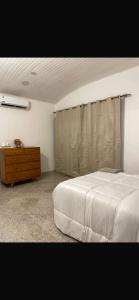 Ένα ή περισσότερα κρεβάτια σε δωμάτιο στο Amplia casa, patio y quincho a minutos de la capital