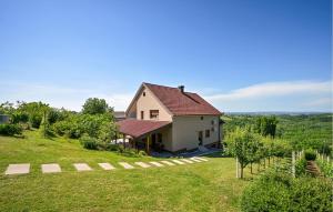 a house on a hill with a green field at Pet Friendly Home In Luzan Biskupecki in Lužan Biškupečki +32 photos