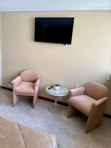 TV a/nebo společenská místnost v ubytování Akros Suite Quito + 5 fotografií