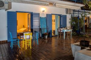 a patio with a table and chairs and a table and chairsktop at Apartments Novka in Izola