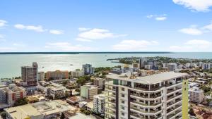 an aerial view of a city and the ocean at Premier Penthouse Serene Harbour Views BBQ & Pool in Darwin