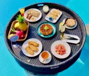 a tray of breakfast foods on a table at Luxury Asian Flair Villa in Koh Phangan +31 photos