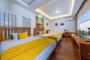 Postel nebo postele na pokoji v ubytování Yueju Designer Homestay