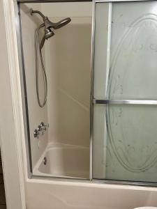 a shower with a glass door in a bathroom at Sweet Spot in Pharr in Pharr +33 photos