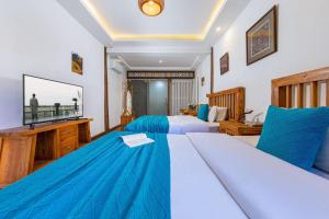 Postel nebo postele na pokoji v ubytování Yueju Designer Homestay