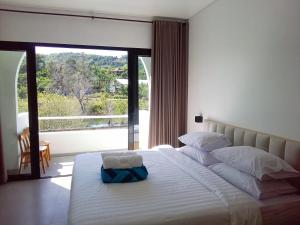 Ένα ή περισσότερα κρεβάτια σε δωμάτιο στο Losbaba Komodo Villa +68 φωτογραφίες