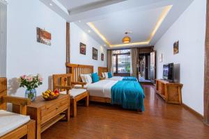 Postel nebo postele na pokoji v ubytování Yueju Designer Homestay