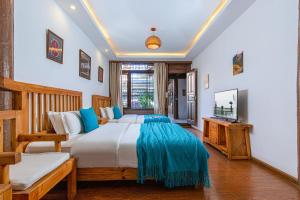 Postel nebo postele na pokoji v ubytování Yueju Designer Homestay