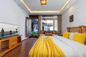 Postel nebo postele na pokoji v ubytování Yueju Designer Homestay + 31 fotografií