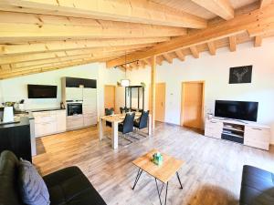 a living room with a couch and a table at Chalet Eigernordwand in Grindelwald
