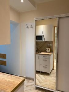 a room with a kitchen with a mirror in it at Dom Stanisławy Papież in Biały Dunajec
