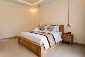 Ένα ή περισσότερα κρεβάτια σε δωμάτιο στο Sikian Villa Ubud Private Pool +33 φωτογραφίες
