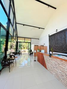 a large living room with a large projection screen at Atlas Central in Pai