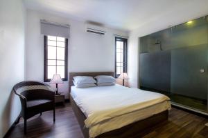 Ein Bett oder Betten in einem Zimmer der Unterkunft Ki Nô Homestay