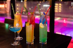 a group of four drinks sitting on a table at Hotel Aqua Citta Naha in Naha +234 photos