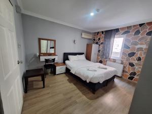 Katil atau katil-katil dalam bilik di Mavikumsal Otel