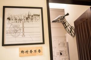 a framed picture of a bicycle on a wall at Salmon B&B in Hualien City