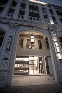a large building with an archway in front of it at Salmon B&B in Hualien City