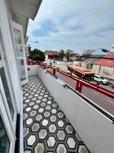 a balcony with a tile floor on a building at The Harbour by Moonknight in George Town +117 photos