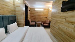 Postel nebo postele na pokoji v ubytování Siris Luxury Cottage