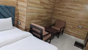 Postel nebo postele na pokoji v ubytování Siris Luxury Cottage