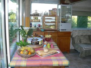 a kitchen with a table with food on it at Chambres d'Hôtes Chez Cécile in Lagnes