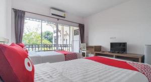 Postel nebo postele na pokoji v ubytování Super OYO 662 Malee Bunga Hotel + 50 fotografií