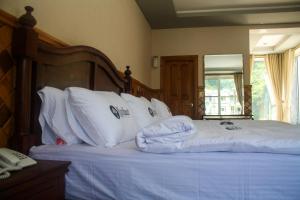 Kunhar Hotel RiverSide Block客房内的一张或多张床位