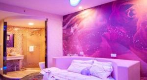 a purple bedroom with a bed and a bathroom at Impression Li River Hotel (Guilin North Railway Station Branch) in Guilin +280 photos