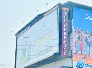 a billboard on the side of a building at Hotel The Ceremony in Kalyan