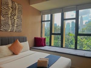 Postel nebo postele na pokoji v ubytování Ceylonz Suites Bukit Bintan By MyStay