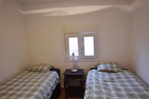Posteľ alebo postele v izbe v ubytovaní Apartament Casa Levante + 23 fotografií
