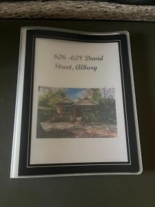 a picture of a house in a picture frame at Executive Cottage, Luxe 1930s Stay in the Heart in Albury