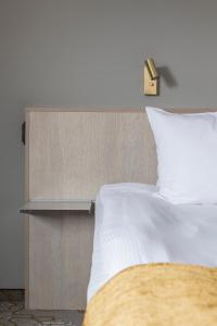 Voodi või voodid majutusasutuse Quality Hotel Royal Corner toas