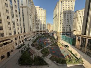 an aerial view of a city with tall buildings at Buston City in Dushanbe