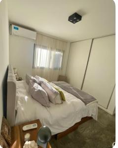 Ένα ή περισσότερα κρεβάτια σε δωμάτιο στο Casa de huésped +1 φωτογραφίες