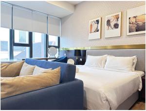 Postel nebo postele na pokoji v ubytování Ceylonz Suites Bukit Bintan By MyStay