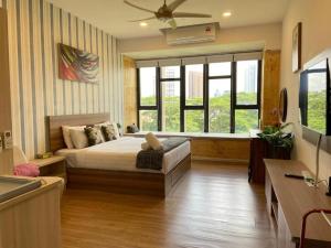 Postel nebo postele na pokoji v ubytování Ceylonz Suites Bukit Bintan By MyStay