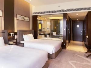 Postel nebo postele na pokoji v ubytování Crowne Plaza Zhangzhou by IHG