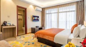 Postel nebo postele na pokoji v ubytování Oriental Hotel