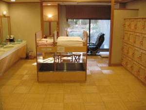 a bathroom with a table with towels on it at Kasuga Hotel in Nara