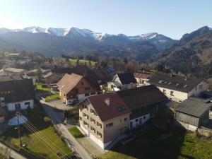 an aerial view of a village with mountains in the background at Stilvoll sanierte Altbau-Wohnung, Dornbirn Kehlegg in Dornbirn