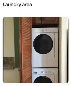a laundry area with a white washer and dryer at 2 bed 2 bath East Village condo with two parking spots and 3 blocks to Ocean in Long Beach