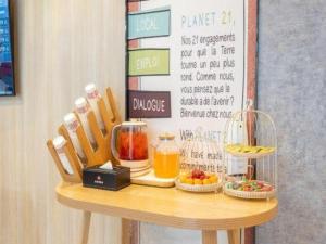 a table with some food on top of it at Ibis Xian Hi-Tech Zone No.7 Keji Rd Hotel in Xi'an