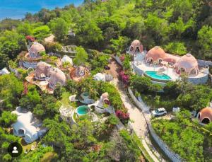 an aerial view of a garden with a resort at Villa Kingdome - 1 Bedroom in Teluknarat