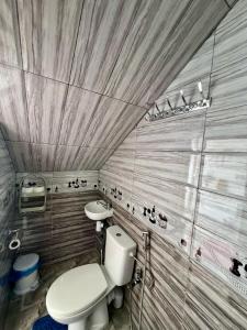 a small bathroom with a toilet and a sink at Maison Berj in Oualidia +13 photos