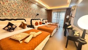 Voodi või voodid majutusasutuse Su Man Designer River View Hotel宿漫设计师江景酒店重庆洪崖洞店 toas