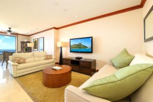 a living room with two couches and a tv at KBM Resorts FREE CAR Beach Villas at Ko Olina BVK-O-1604 Penthouse Ocean Views in Kapolei